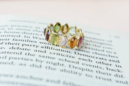 Oval-cut multicolor tourmaline double-row eternity ring in 18K gold