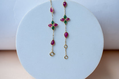 Gold bracelet with ruby and emerald quatrefoil clusters