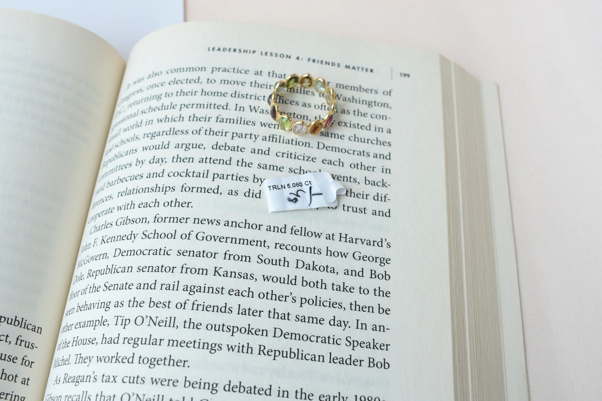 Oval-cut multicolor tourmaline double-row eternity ring in 18K gold