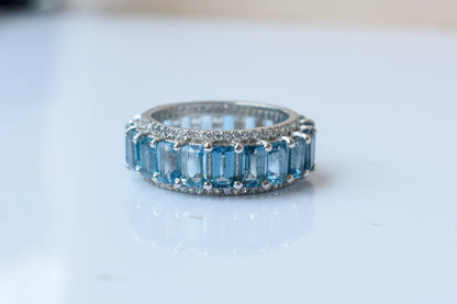 Sky blue topaz wide emerald-cut eternity ring in 925 silver