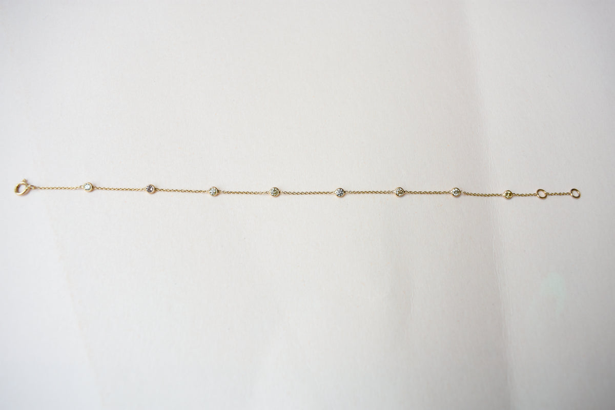 18K gold diamonds-by-the-yard bracelet with bezel-set round diamonds
