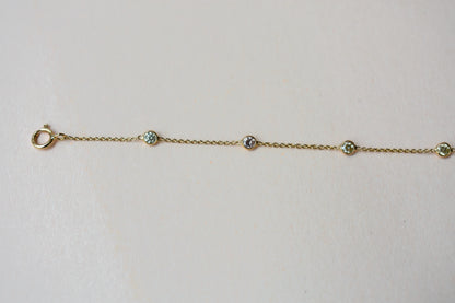 18K gold diamonds-by-the-yard bracelet with bezel-set round diamonds