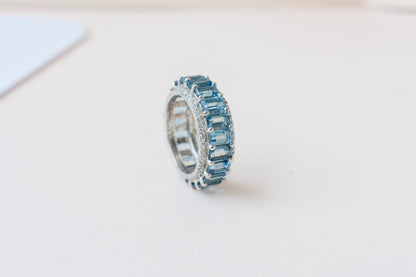 Sky blue topaz wide emerald-cut eternity ring in 925 silver