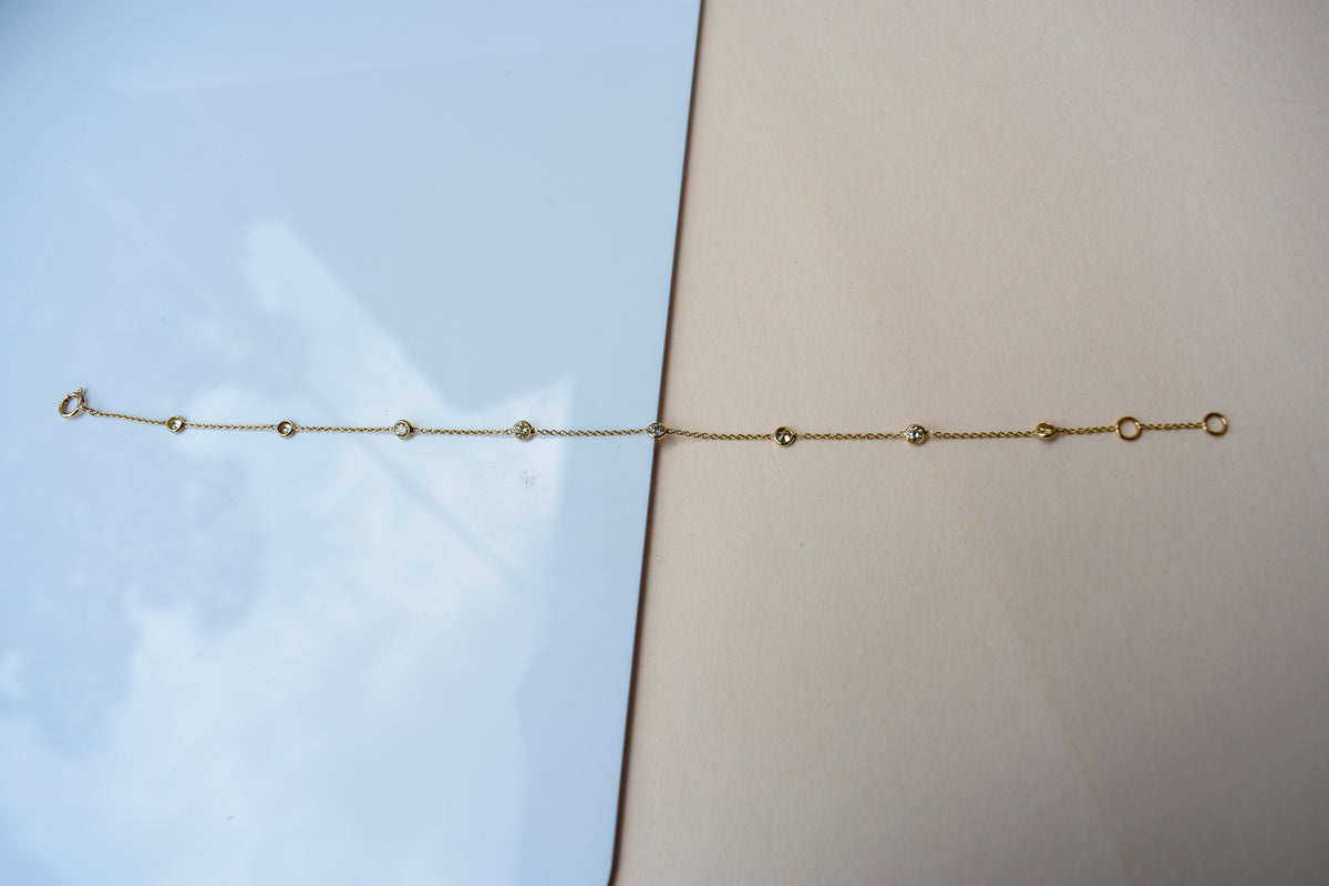 18K gold diamonds-by-the-yard bracelet with bezel-set round diamonds