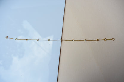 18K gold diamonds-by-the-yard bracelet with bezel-set round diamonds