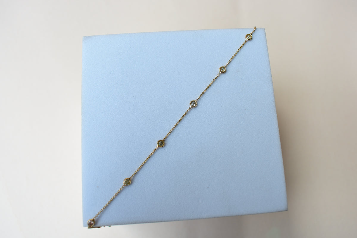 18K gold diamonds-by-the-yard bracelet with bezel-set round diamonds