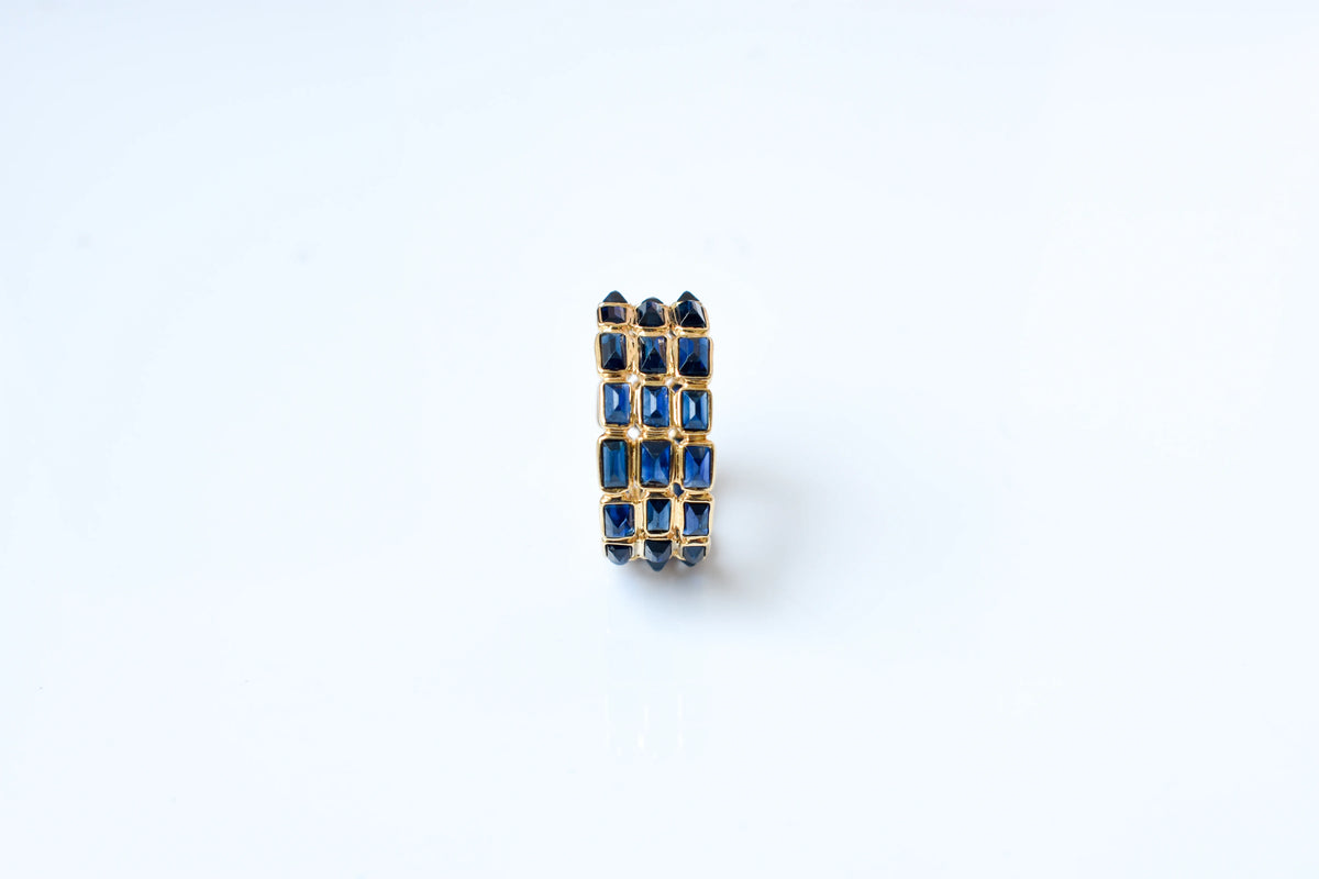 Baguette-cut blue sapphire three-row eternity ring in 18K gold