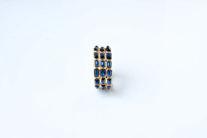 Baguette-cut blue sapphire three-row eternity ring in 18K gold