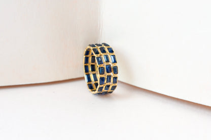 Baguette-cut blue sapphire three-row eternity ring in 18K gold