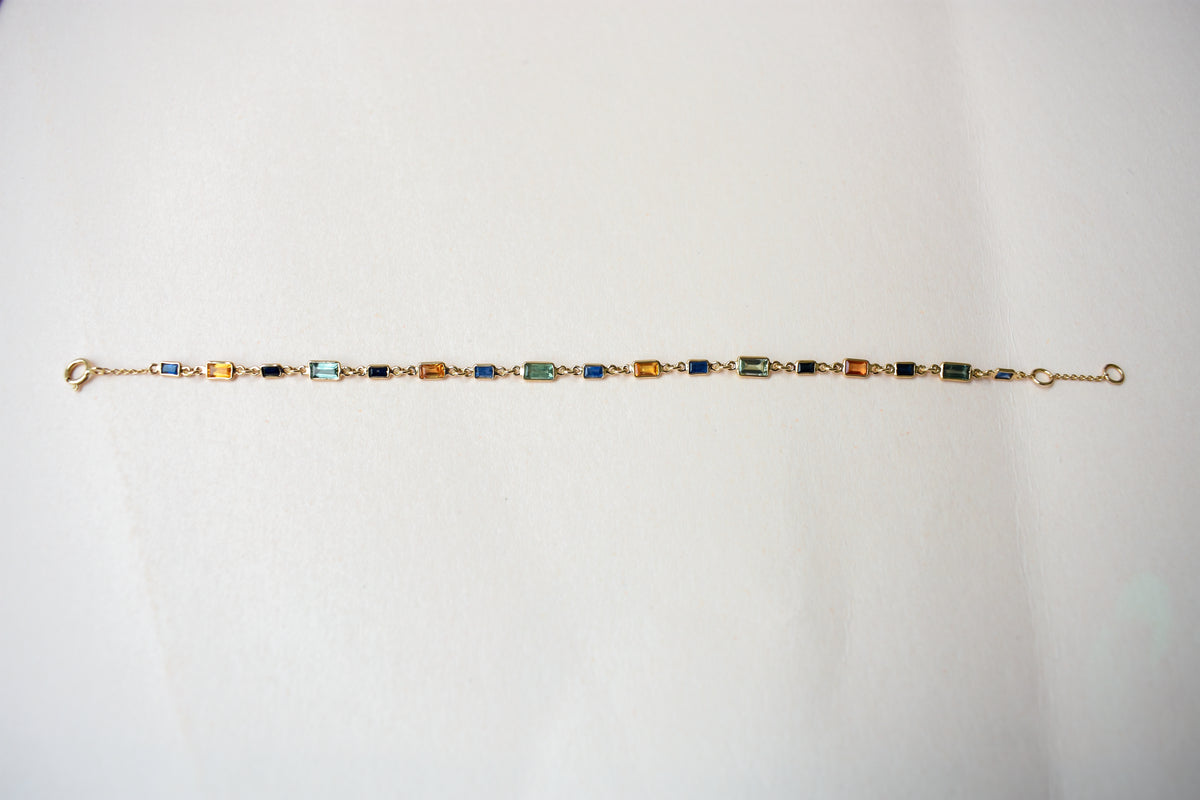 18K gold paperclip chain bracelet with multi-coloured sapphire stations