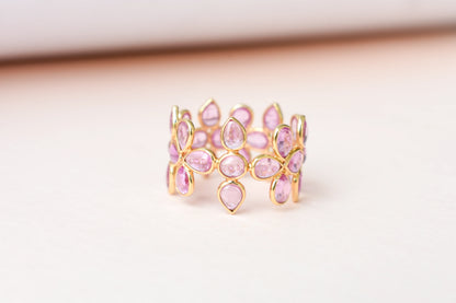 Cabochon pink sapphire clover eternity ring in 18K gold