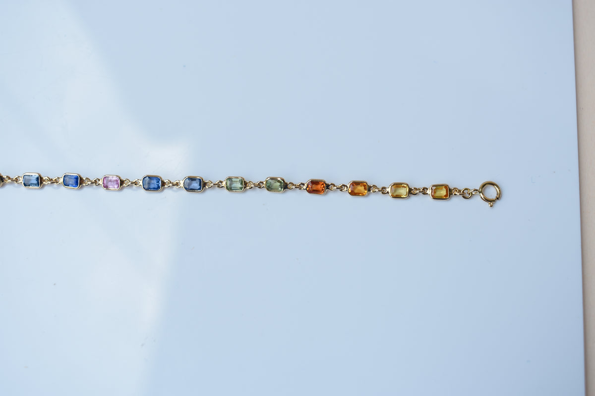 18K gold bracelet with multi-coloured sapphire stations