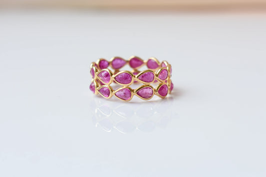 Pear-cut ruby woven double-row eternity ring in 18K gold