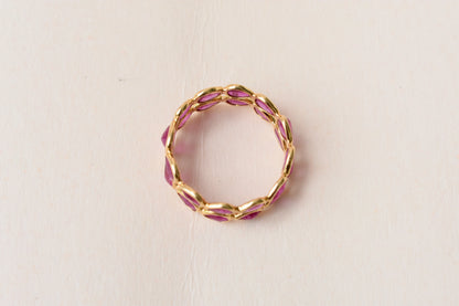 Pear-cut ruby woven double-row eternity ring in 18K gold
