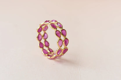 Pear-cut ruby woven double-row eternity ring in 18K gold