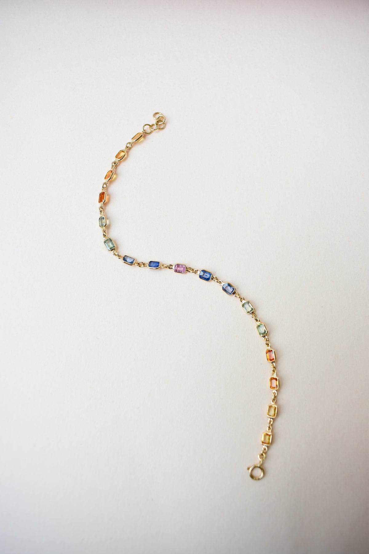 18K gold bracelet with multi-coloured sapphire stations