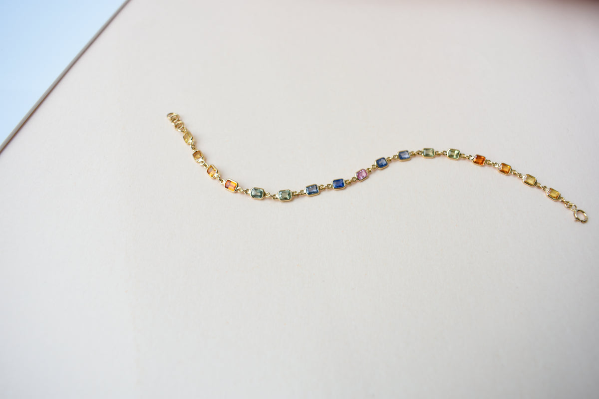 18K gold bracelet with multi-coloured sapphire stations