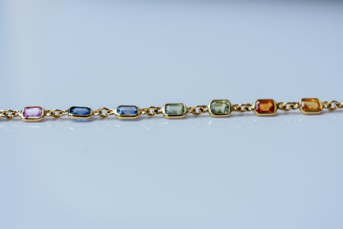 18K gold bracelet with multi-coloured sapphire stations