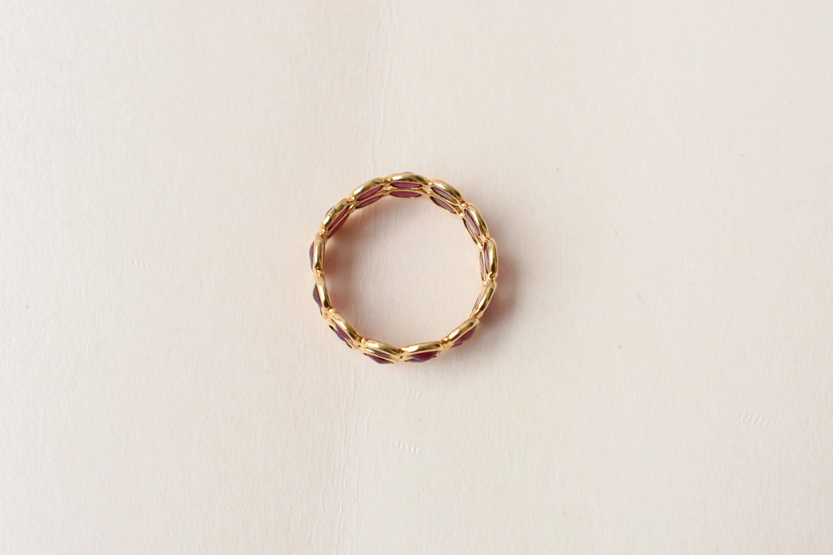 Oval-cut ruby honeycomb double-row eternity ring in 18K gold