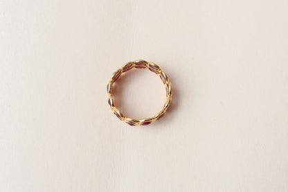 Oval-cut ruby honeycomb double-row eternity ring in 18K gold