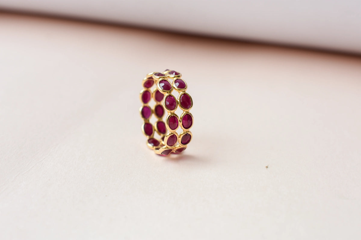 Oval-cut ruby honeycomb double-row eternity ring in 18K gold