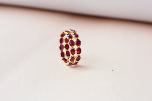 Oval-cut ruby honeycomb double-row eternity ring in 18K gold