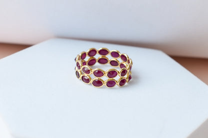 Oval-cut ruby honeycomb double-row eternity ring in 18K gold