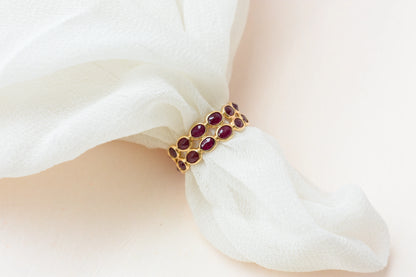 Oval-cut ruby honeycomb double-row eternity ring in 18K gold