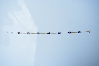 18K gold bracelet with pear-cut tanzanite stations