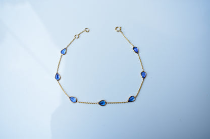 18K gold bracelet with pear-cut tanzanite stations