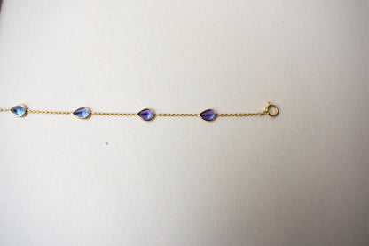 18K gold bracelet with pear-cut tanzanite stations