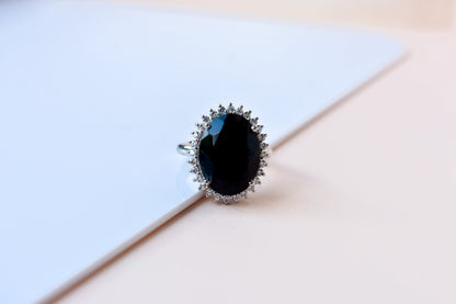 Oval black onyx halo ring in 925 silver with white cubic zirconia border