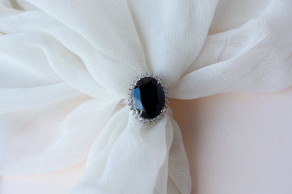 Oval black onyx halo ring in 925 silver with white cubic zirconia border
