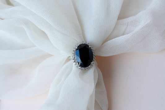 Oval black onyx halo ring in 925 silver with white cubic zirconia border
