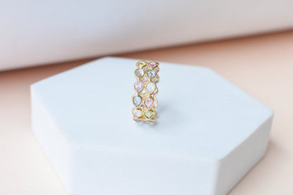 Pear-cut pastel multicolor sapphire eternity ring in 18K gold
