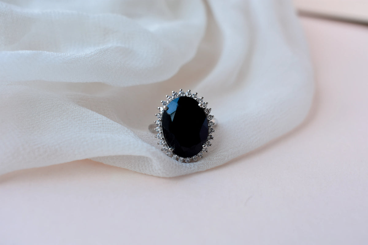 Oval black onyx halo ring in 925 silver with white cubic zirconia border