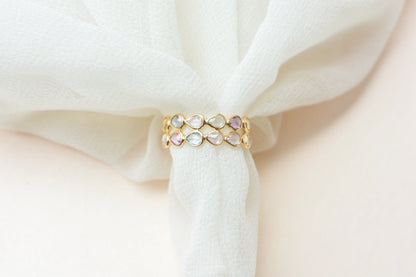 Pear-cut pastel multicolor sapphire eternity ring in 18K gold
