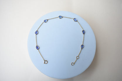 18K gold bracelet with pear-cut tanzanite stations