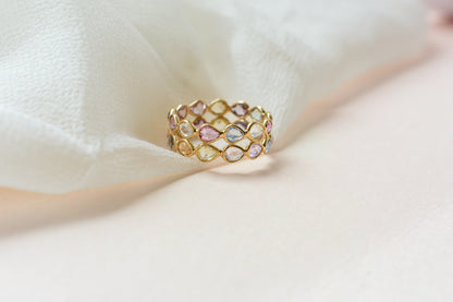 Pear-cut pastel multicolor sapphire eternity ring in 18K gold