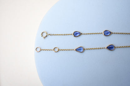 18K gold bracelet with pear-cut tanzanite stations