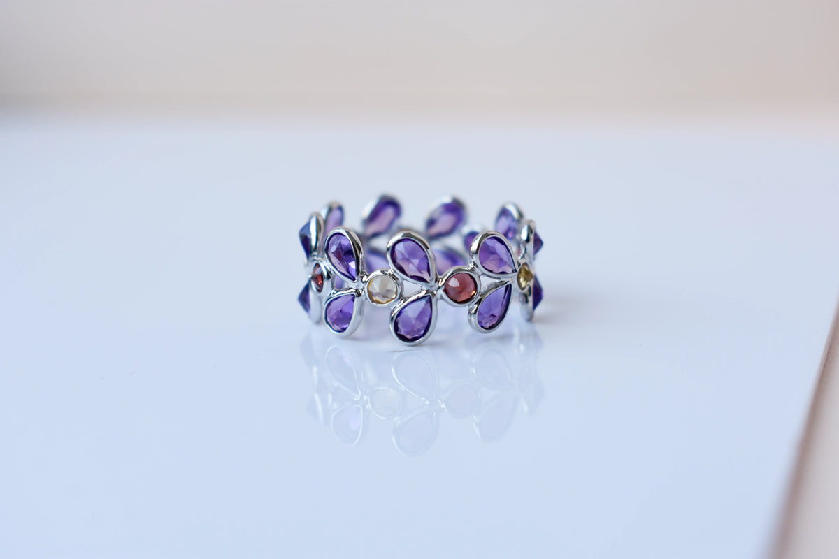 Multi gemstone marquise eternity ring in 925 silver with amethyst, garnet, and citrine-toned stones