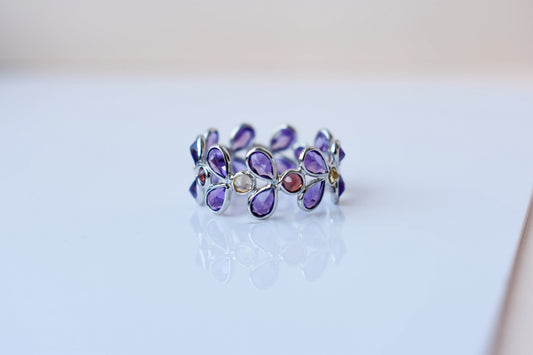 Multi gemstone marquise eternity ring in 925 silver with amethyst, garnet, and citrine-toned stones