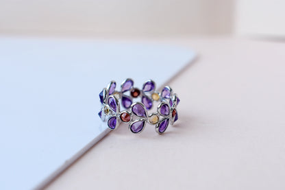 Multi gemstone marquise eternity ring in 925 silver with amethyst, garnet, and citrine-toned stones