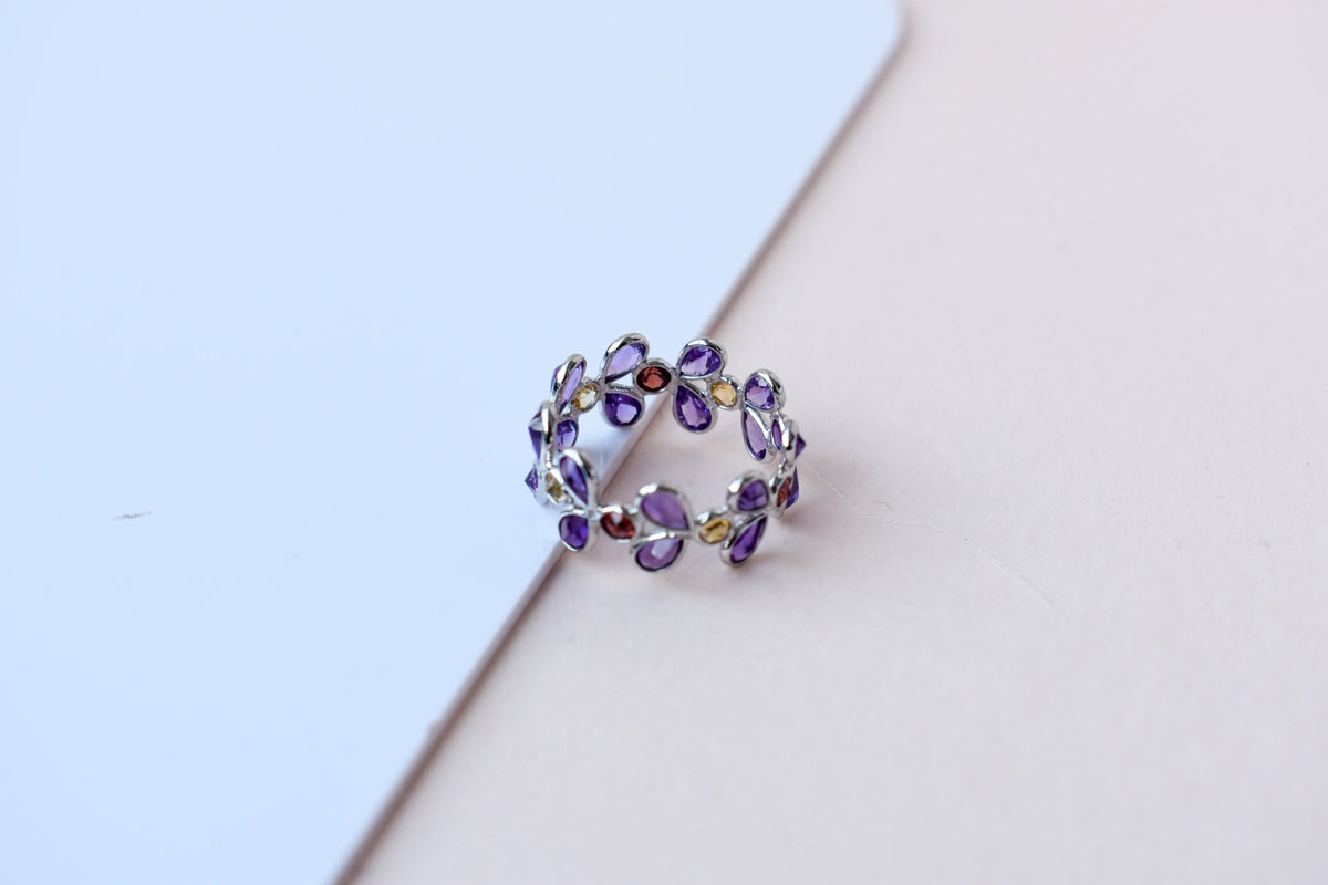 Multi gemstone marquise eternity ring in 925 silver with amethyst, garnet, and citrine-toned stones