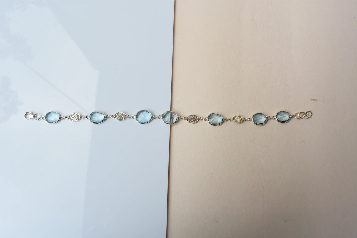 Blue gemstone bezel bracelet in silver with lobster clasp