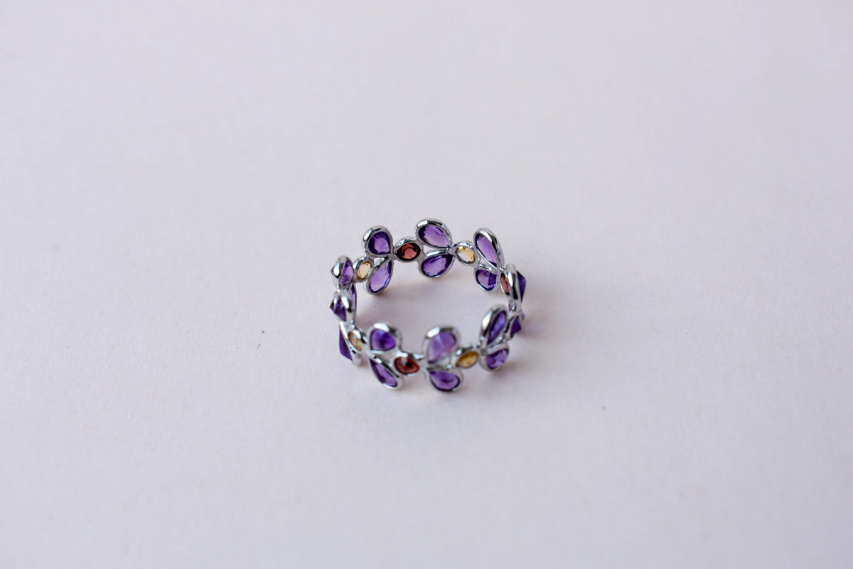 Multi gemstone marquise eternity ring in 925 silver with amethyst, garnet, and citrine-toned stones