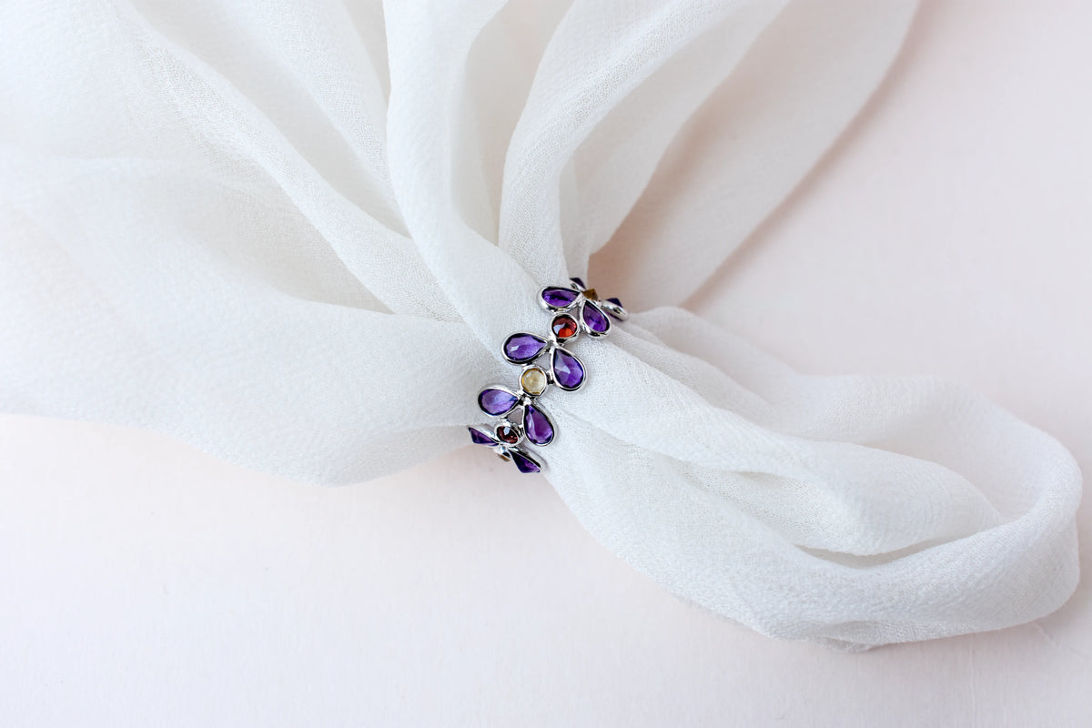 Multi gemstone marquise eternity ring in 925 silver with amethyst, garnet, and citrine-toned stones