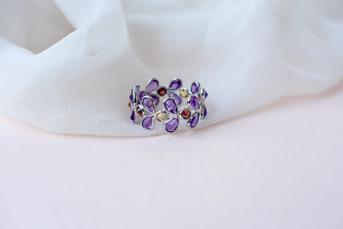 Multi gemstone marquise eternity ring in 925 silver with amethyst, garnet, and citrine-toned stones