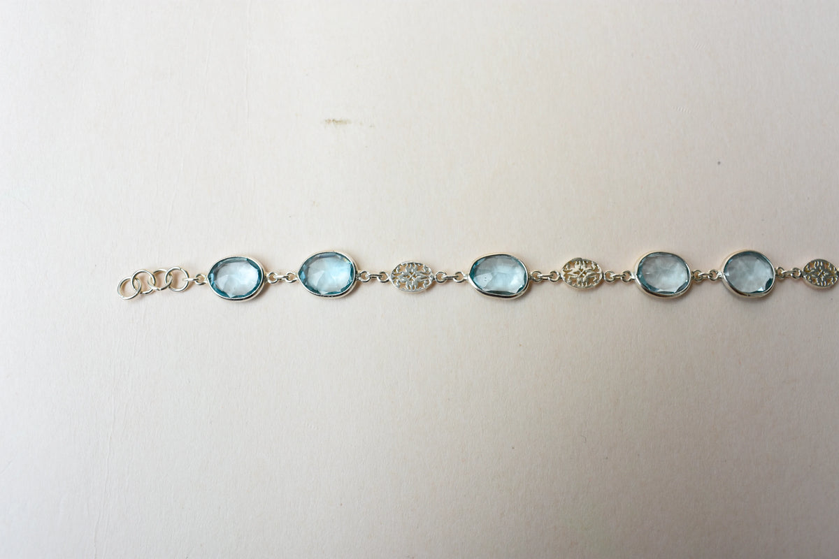 Blue gemstone bezel bracelet in silver with lobster clasp