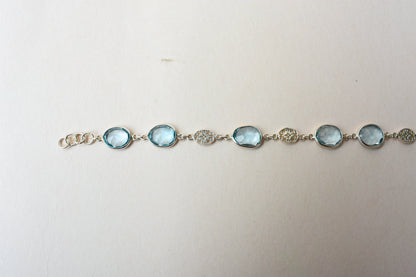 Blue gemstone bezel bracelet in silver with lobster clasp
